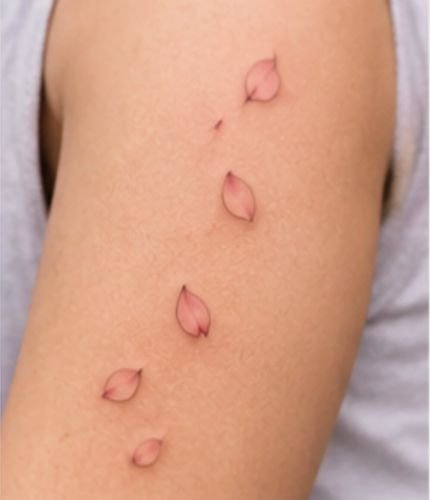 Falling Cherry Blossom Petals Tattoo